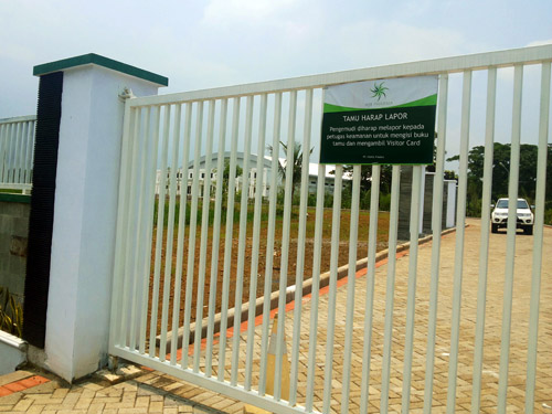 Closer look at gate with visitor sign